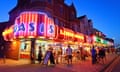 Oasis bingo hall, with neon frontage, and brightly lit amusements