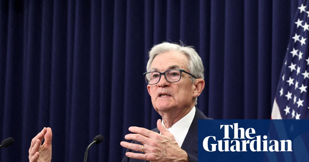 Fed cuts interest rates by a quarter point amid apparent split over US economy