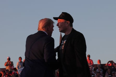 Elon Musk stands with Donald Trump on the stage in Butler, Pennsylvania