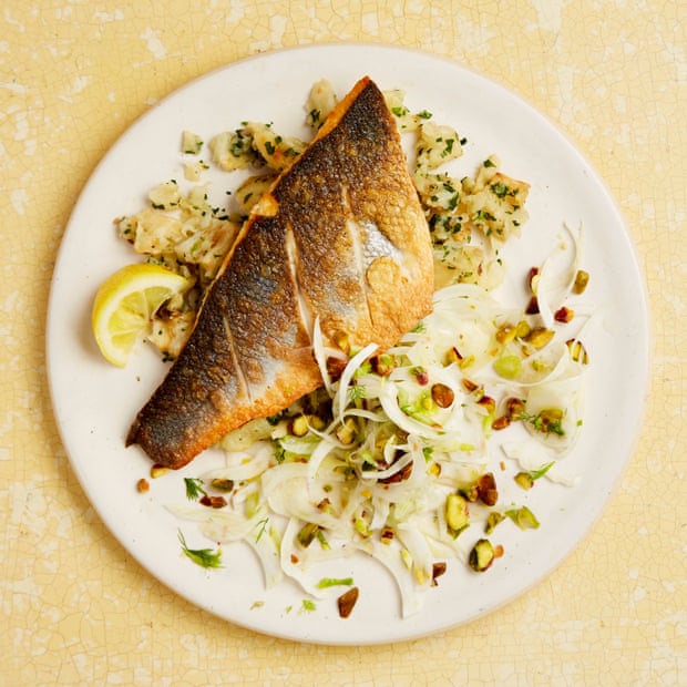 Yotam Ottolenghi’s grilled sea bass with crushed celeriac and fennel and pistachio salad.