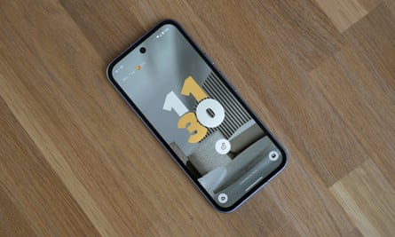 The lock screen of the Google Pixel 9a on a table.