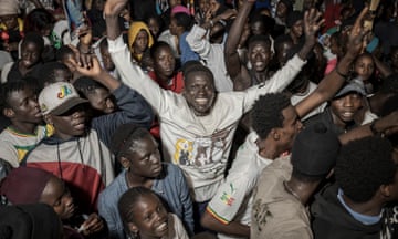 People in Dakar celebrate the presumed win of Bassirou Diomaye Faye in Senegal's presidential elections