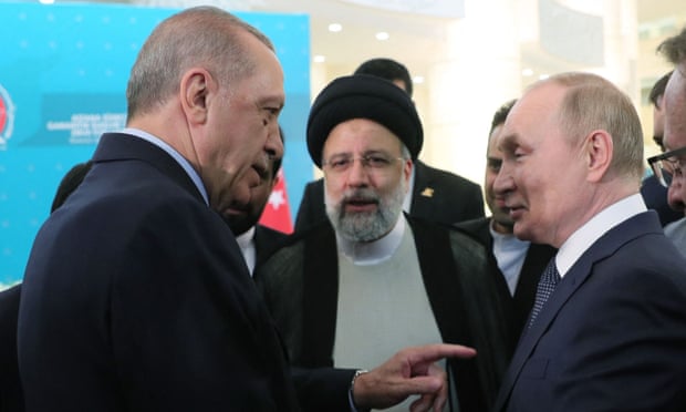Vladimir Putin met Iran’s president, Ebrahim Raisi (centre), and the Turkish president, Recep Tayyip Erdoğan (left), in Tehran.