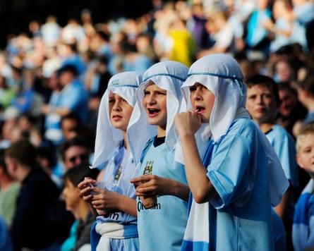 Boys dressed in head-scarves before the first game after the club was bought by the Abu Dhabi United group.