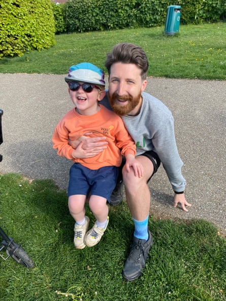 William holding his son.