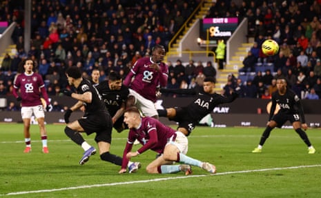 A flying header from Cristian Romero (centre left) restores parity at Turf Moor.