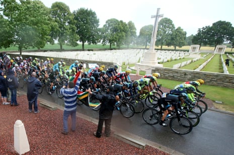 The peloton passes the Delville Wood WWI Cemetery,