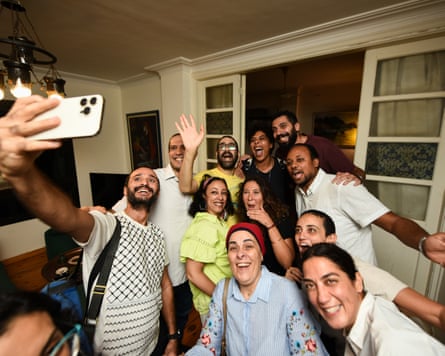 Alaa Abd el-Fattah in the centre of a group taking a selfie