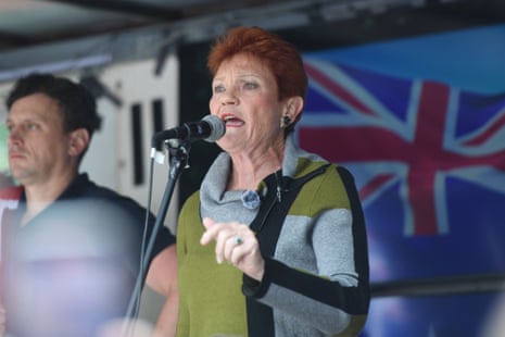 Pauline Hanson speaks in front of Australian flag