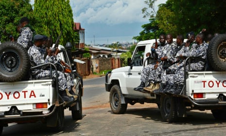 Burundian security officers secure the scene of a grenade attack in Bujumbura that killed Brigadier General Athanase Kararuza on 25 April 2016