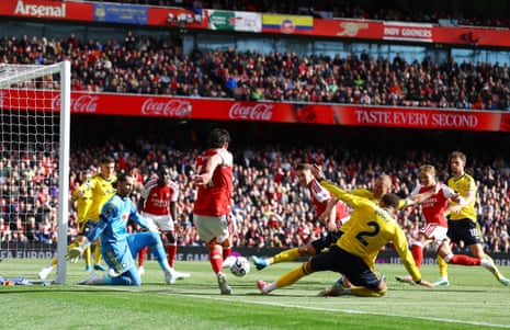 Arsenal's Declan Rice passes the ball into the six yard box.