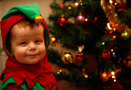Naughty or nice? A Child dressed as a Christmas elf.
