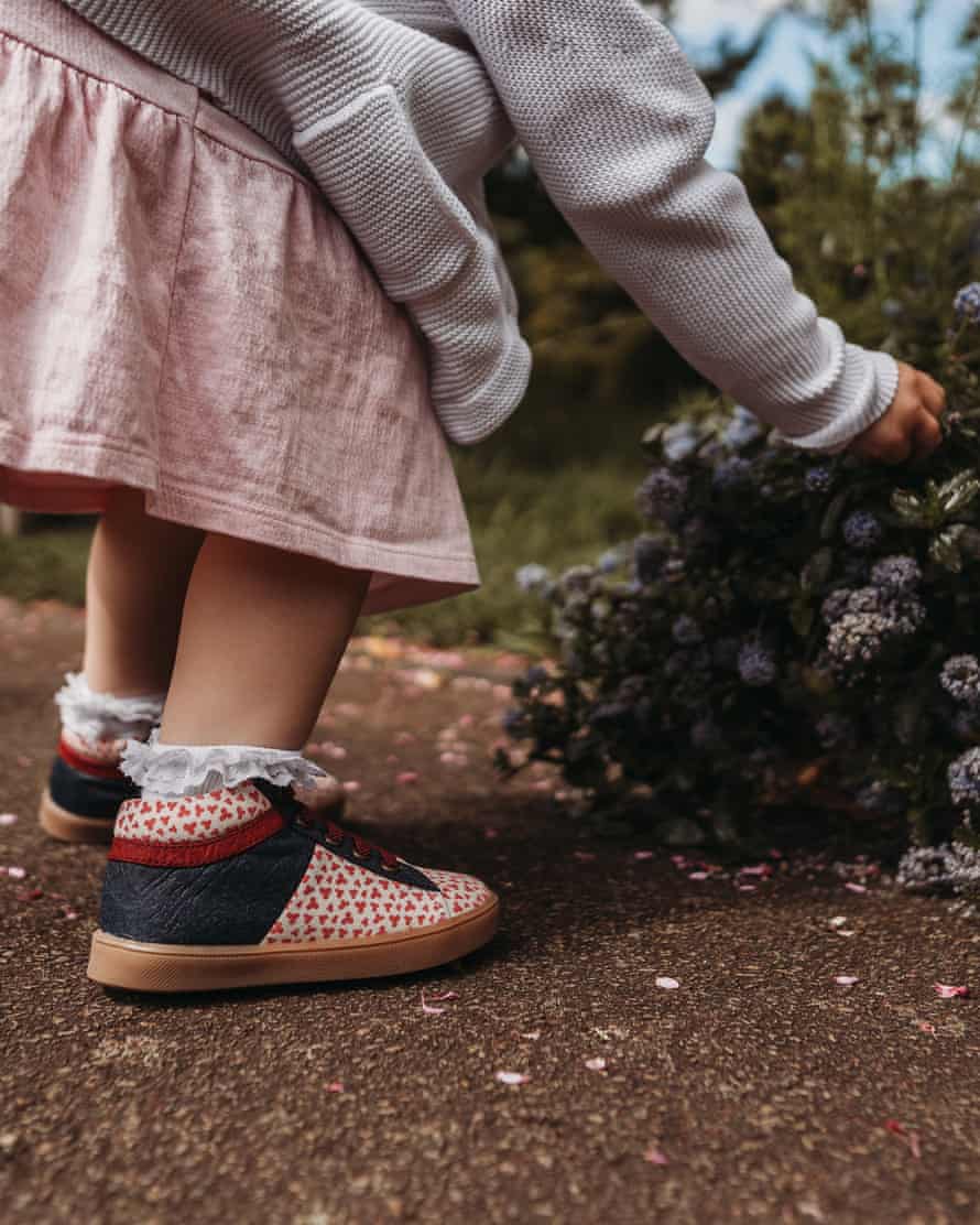 A young girl wears Pip & Henry shoes