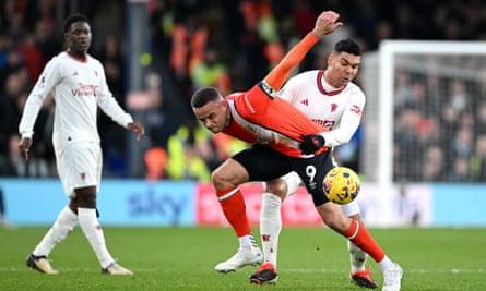 Casemiro grapples with Carlton Morris during Manchester United’s hard-fought win at Luton.