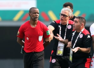 Tunisia coach Mondher Kebaier remonstrates with the referee Janny Sikazwe over his dodgy time-keeping.
