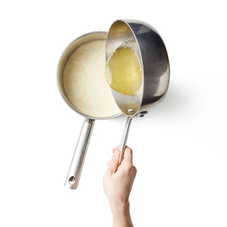 Felicity Cloake masterclass lemon posset step 6. Heat the cream and spices. Gently heat the cream until it’s barely simmering, then take off the heat. Pour in the warm lemon syrup, whisking to combine.