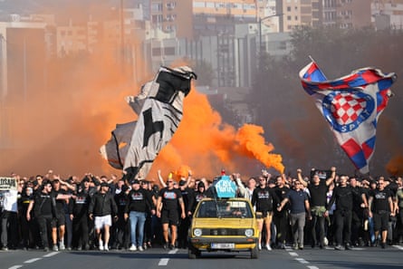 Thousands of members of the HajdukâÂÂs Torcida fan club march toward the stadium ahead of the Conference League match against Ajax in Split