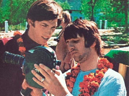 Ringo Starr shows Paul Saltzman how to use his film camera.