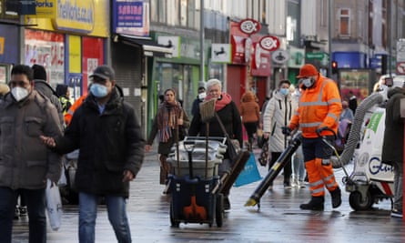 Road cleaners in the town centre of Ilford in the borough of Redbridge