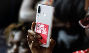 A woman films in Kenya's high court after the country's anti-gay law was upheld on 24 May.