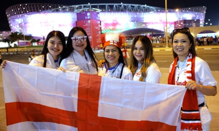 A group of England supporters from Thailand outside the Ahmad bin Ali Stadium before the match against Wales.