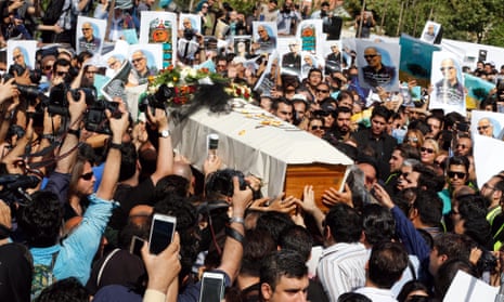 Iranians carry the coffin of the Iranian film director Abbas Kiarostami at a funeral ceremony in Tehran, Iran.