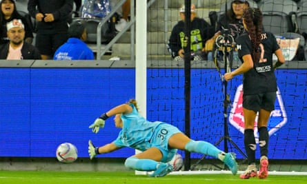 Mackenzie Arnold dives to block a shot as goalkeeper for Portland Thorns in the NWSL