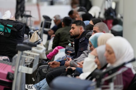 Passengers whose flights were cancelled wait at the departure terminal of Rafik Hariri International Airport in Beirut, Lebanon