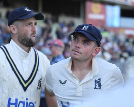 The Warwickshire players Chris Woakes and Ethan Bamber contemplate their achievement after helping their team win the 2026 County Championship.