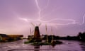 Lightning is seen over Medmerry Mill, Selsey, in West Sussex in the early hours of Thursday as thunderstorms swept the south of England