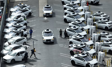 Waymo autonomous vehicles sit parked in a staging area on 8 June 2023 in San Francisco, California.