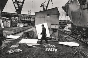 A worker leaving a ship in construction in Gdansk Shipyard, 1990
