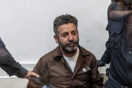 Spanish activist Saif Abu Keshek sat in court.