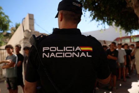 A police officer stands guard