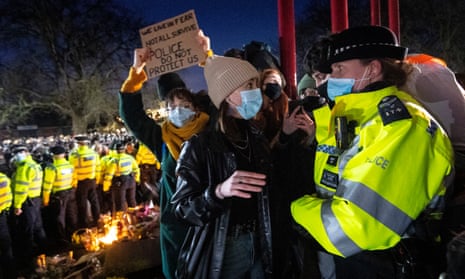 Police and protesters at a vigil for Sarah Everard on Clapham Common, London, 13 March 2021