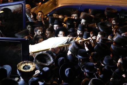 Mourners at the funeral of an ultra-Orthodox man killed in a crush at Lag B’Omer in Mount Meron.