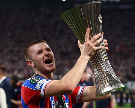 Adam Wharton celebrates with the Conference League trophy