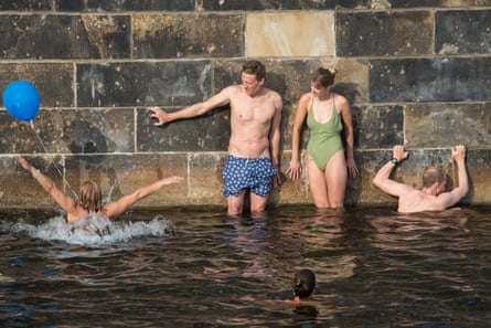 People swimming in Spree River