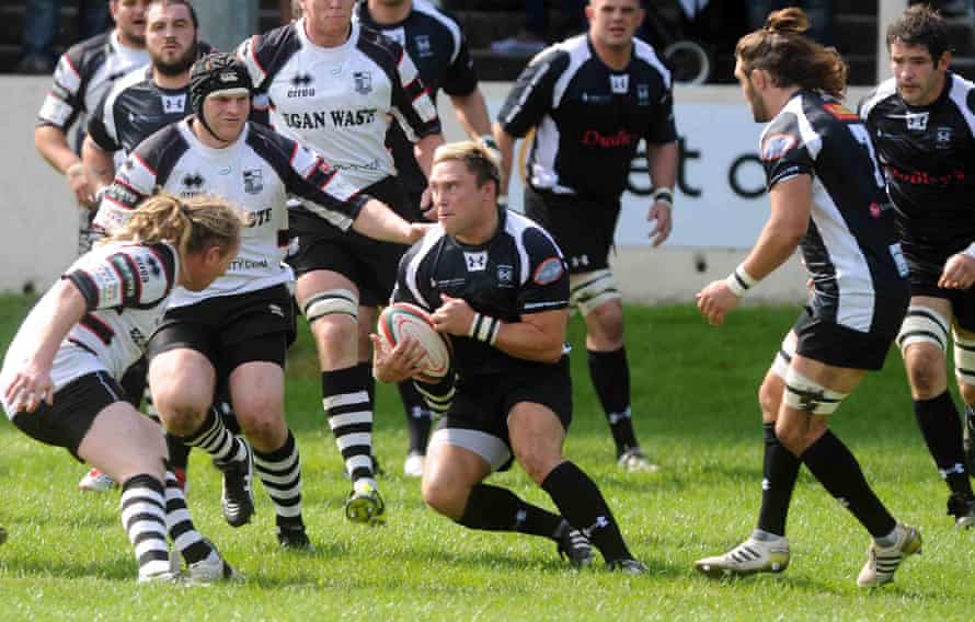 Gerwyn Price looks for a way through the Pontypridd defence when playing rugby union for Cross Keys in 2012