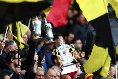 A cup tie isn’t a cup tie without replica trophies in the crowd.