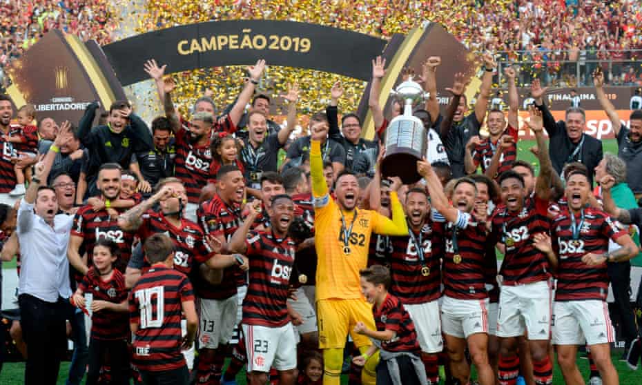 Players of Brazil’s Flamengo celebrate with the trophy after winning the Copa Libertadores final.