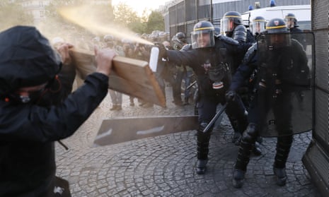 Anti-fascists clash with police officers as they demonstrate in Paris.