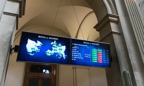 A screen with the main index of the international markets at the Spanish Stock Exchange in Madrid, today