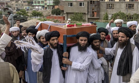 Mourners carry the body of a victim of a mosque bombing in Kabul, Afghanistan.