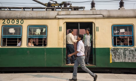 Indian passengers travel on a local train