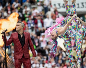 Robbie Williams performs during the opening ceremony.