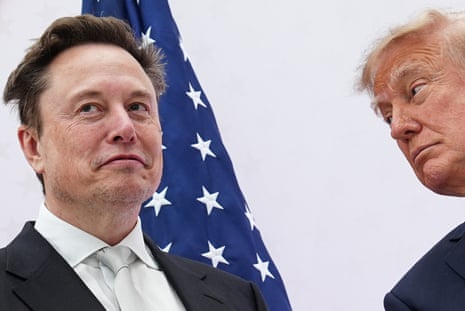 Two older men in front of a US flag
