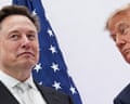 Two older men in front of a US flag