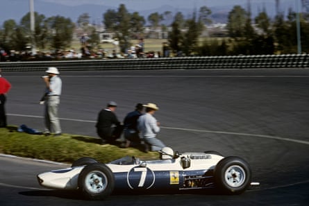 John Surtees in a blue and white Ferrari