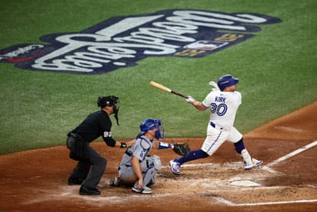 Alejandro Kirk of the Blue Jays hits a single during the fourth inning of Game 1.